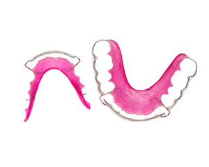 close up pink dental braces or retainer isolated on white background