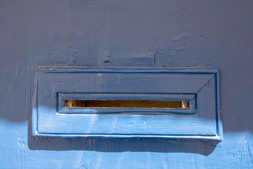 A simple design of a blue mail slot