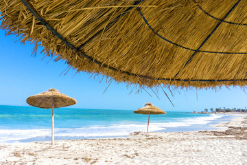 Parasols on the Beach of Djerba in Tunisia