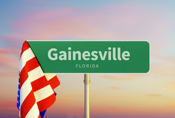 Gainesville – Florida. Road or Town Sign. Flag of the united states. Sunset oder Sunrise Sky