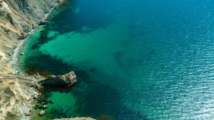 Scenic view of the waves of the blue sea among the rocks.