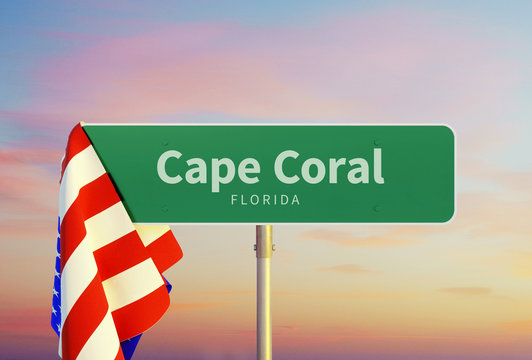 Cape Coral – Florida. Road or Town Sign. Flag of the united states. Sunset oder Sunrise Sky