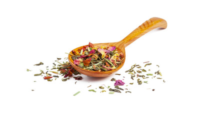 Dried tea on a wooden spoon, isolated on white