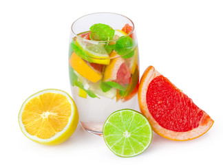 cold drink with different citrus and herbs in glasses on a white background. Cocktail
