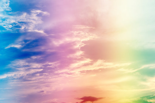 A soft fog cloud background with pastel colored orange to blue gradient