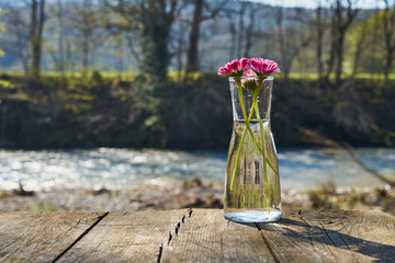 Image of a glass flask with flowers.