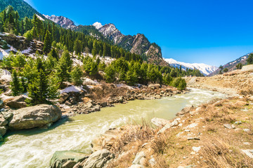 Fototapeta na wymiar Beautiful River and snow covered mountains landscape Kashmir state, India .