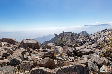 Mountain summit view with landscape of Andes and Aconcagua on clear day in La Campana National park in central Chile, South America