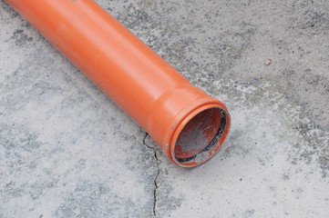 Sewer pipe on concrete background