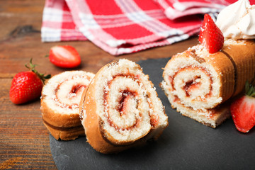 Sweet roll with jam, strawberries and meringues