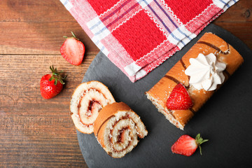 Sweet roll with jam, strawberries and meringues