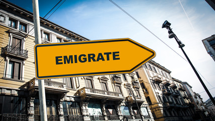 Obraz premium Street Sign to Emigrate