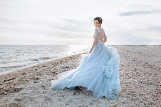 Adorable bride in a blue dres