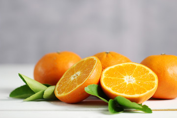 Fresh oranges fruit on white table background.