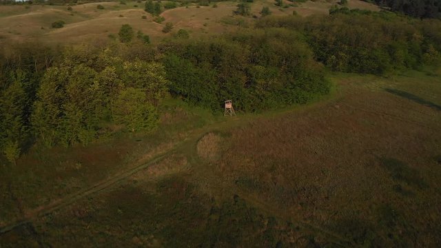 Aerial View Of A Hunting Hut At A Meadow, Morning, Lens Flare