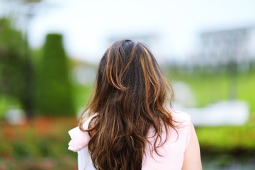 Portrait of a woman looking in back closeup outdoor