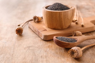 Composition with poppy seeds on wooden table