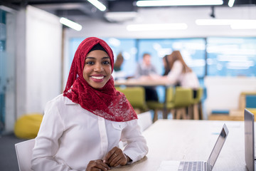black muslim business woman ,working on laptop computer