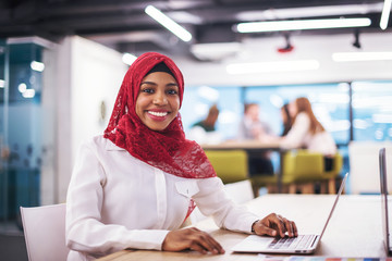 black muslim business woman ,working on laptop computer