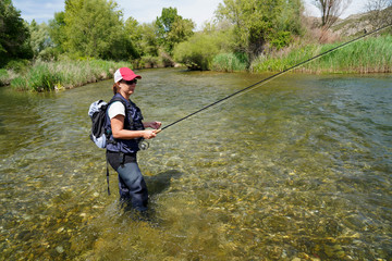 woman fishing in the river