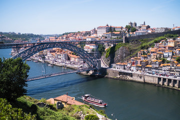 Fototapeta na wymiar View of the Douro river and Dom Luis I Bridge in Porto, Portugal.