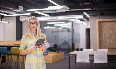 Fototapeta na wymiar blonde businesswoman working online using digital tablet