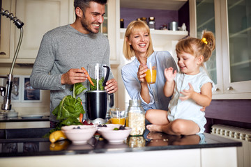 Parents with daughter having breakfast