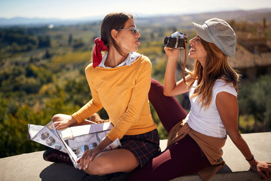 Fun travel - friends enjoying in vacation time and taking picture..