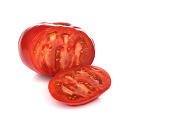 Large ripe tomato isolated on white background. Sliced tomato, a slice of tomato.
