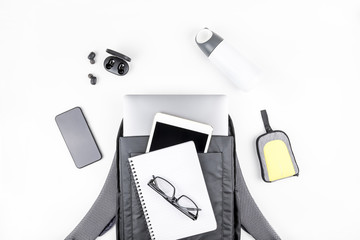Fototapeta na wymiar Modern backpack with laptop and tablet inside