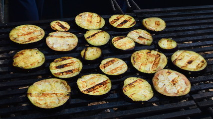 Aubergine slices on a grill grate