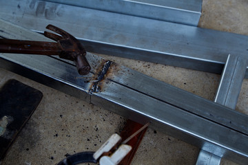 The welders are welding steel in the factory