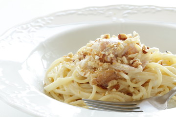 Italian food, bacon and walnut cream spaghetti