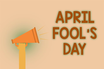 Word writing text April Fool s is Day. Business concept for Practical jokes humor pranks Celebration funny foolish Hand brown loud speaker sound public message hot issue announcement