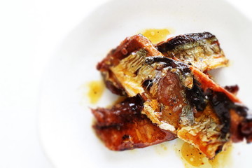 Canned food, pacific saury on dish with copy space