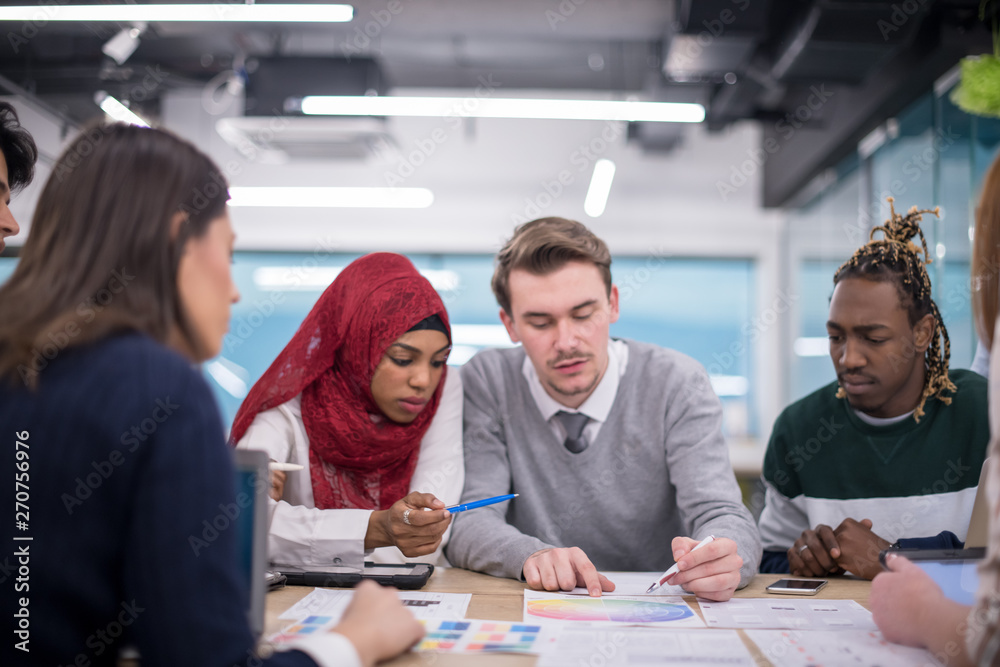 Wall mural Multiethnic startup business team having meeting