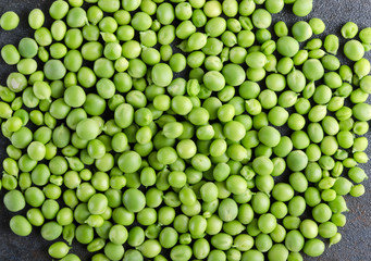 Fresh shelling peeas as a background on the grey surface