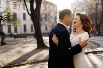 Bride and Groom on Wedding Day in city.