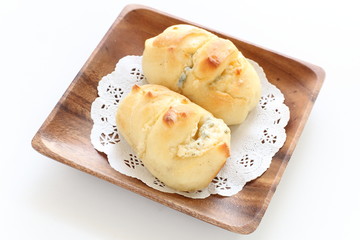 homemade cheese bread on wooden plate