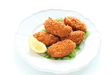 Oyster on dish with lemon