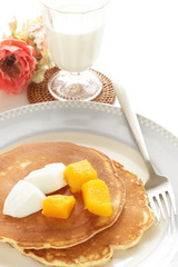 Fototapeta premium Frozen mango on panccake with copy space