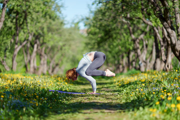 Photo of woman standing in arms in yoga at woods