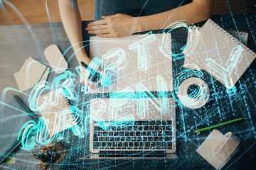 Cryptocurrency hologram over hands taking notes background. Concept of blockchain. Multi exposure