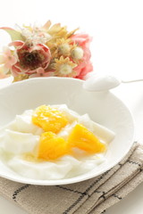Peach and yogurt on bowl