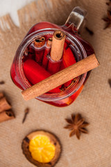 Mulled wine and spices on white wooden background. Selective focus. Top view.