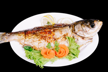 Fried fish on a black background