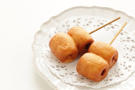 Corn dog on dish with copy space