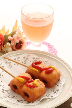 Corn dog on dish with copy space