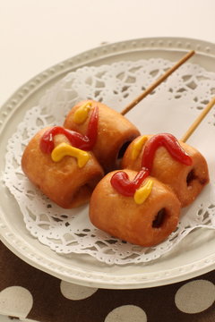 Corn dog on dish with copy space