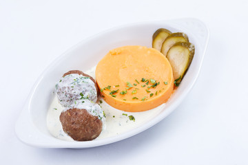 meatballs with mashed potato on the white